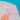 Coral cameo brooch worn on a white collar