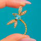 9ct Gold blue Paste and natural Seed Pearl dragonfly charm, front view of the blue Paste dragonfly on blue