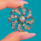 French Silver Paste pendant, front detail of the swirling cluster and graduated stones