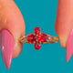 10ct Gold Padparadscha Orange Sapphire Flower Ring, front of four-stone Sapphire flower