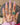 Outstretched hand with jewellery stacked on the back