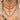 A paste riviere necklace, a coral necklace and a coral pendant worn on the neck